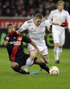 Leverkusen's Vidal challenges Munich's Schweinsteiger during their German Bundesliga soccer match in Leverkusen