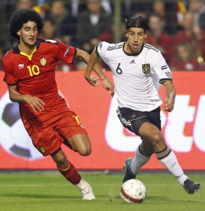 Germany's Khedira is chased by Belgium's Fellaini during their Euro 2012 qualifying soccer match in Brussels